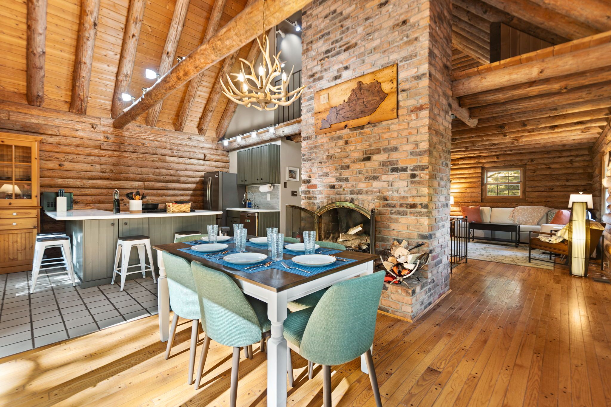 Open dining area beside the stone fireplace