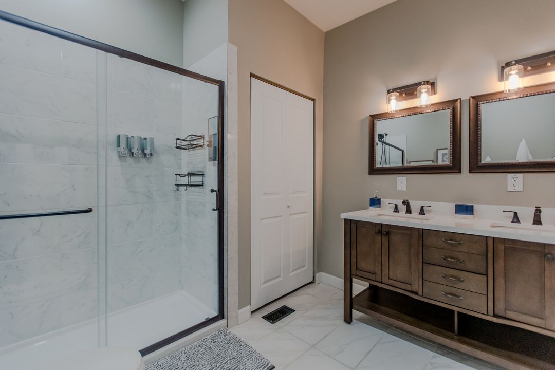 The primary en-suite bathroom with a double vanity
