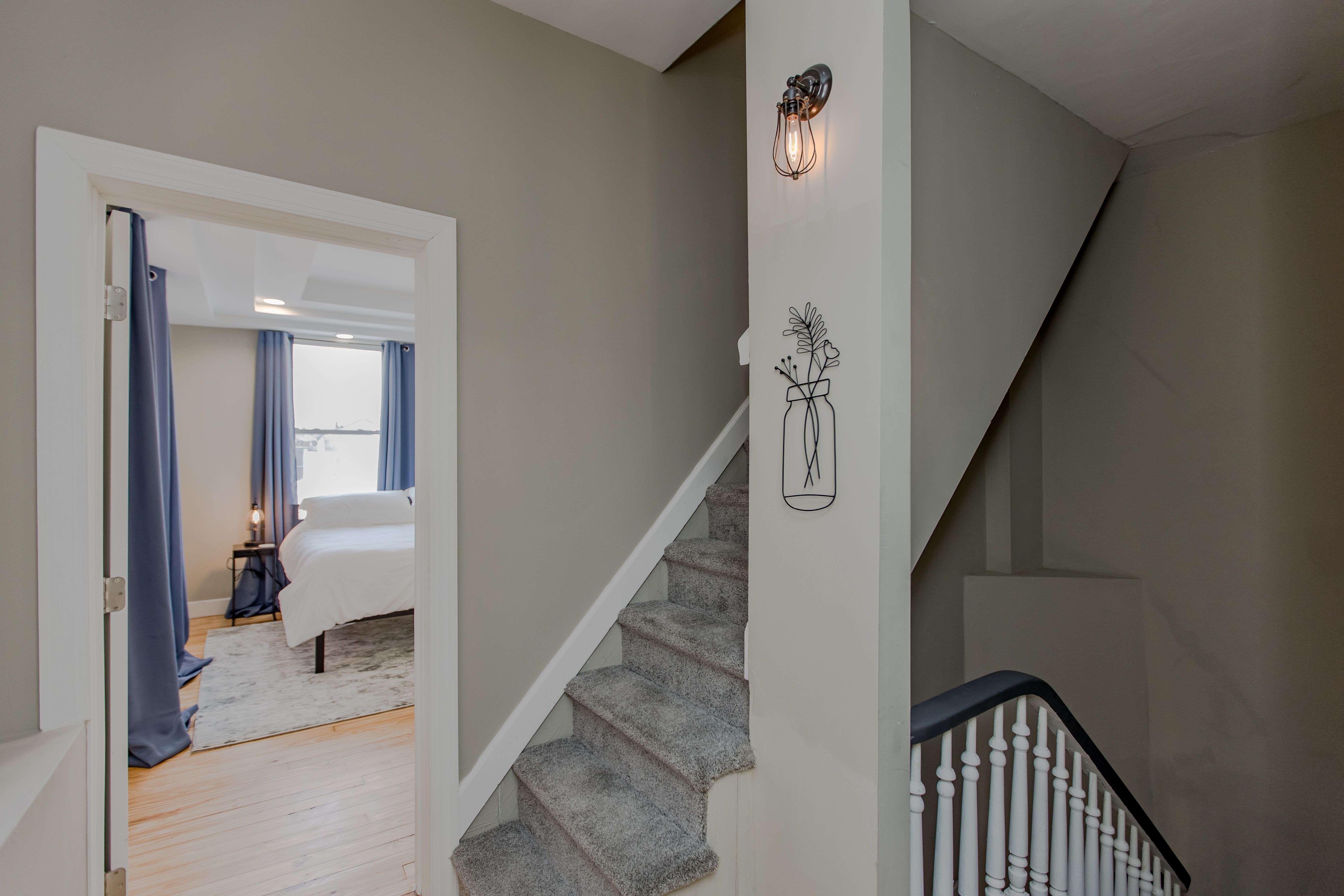 The staircase up to the upper-level bedrooms