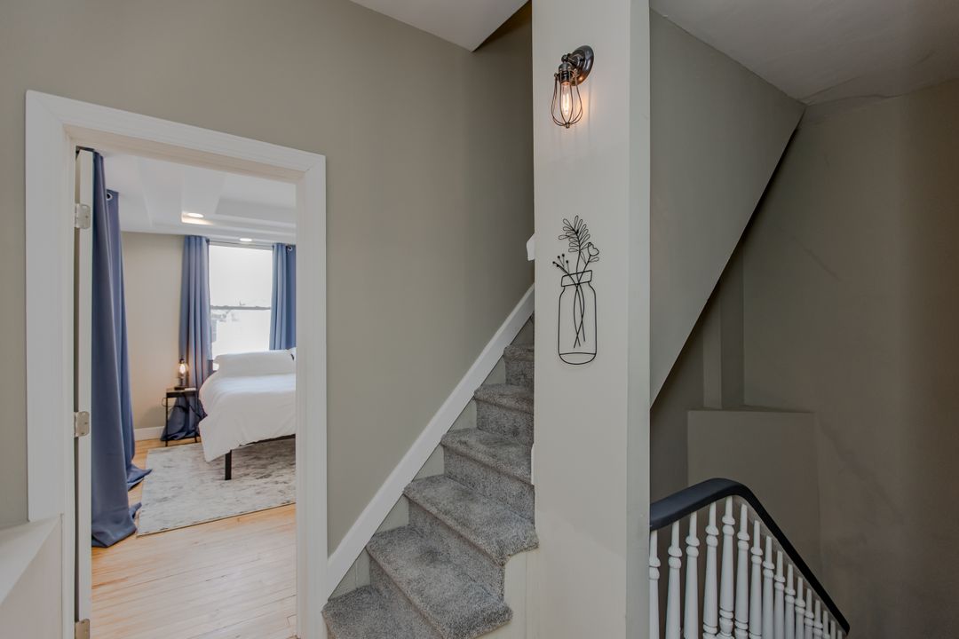 The staircase up to the upper-level bedrooms